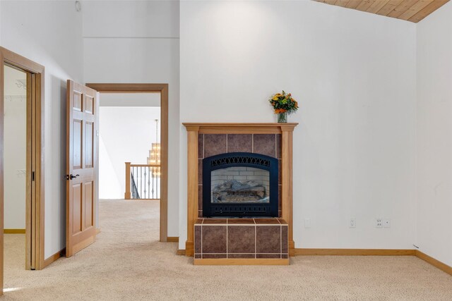 303 Wyant Ln, Hamilton, MT 59840 - unfurnished living room with carpet flooring, a fireplace, and baseboards