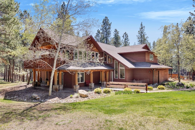 303 Wyant Ln, Hamilton, MT 59840 - rear view of house featuring a yard, a patio area, and roof with shingles