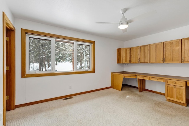 303 Wyant Ln, Hamilton, MT 59840 - unfurnished office with built in desk, light colored carpet, baseboards, and a ceiling fan