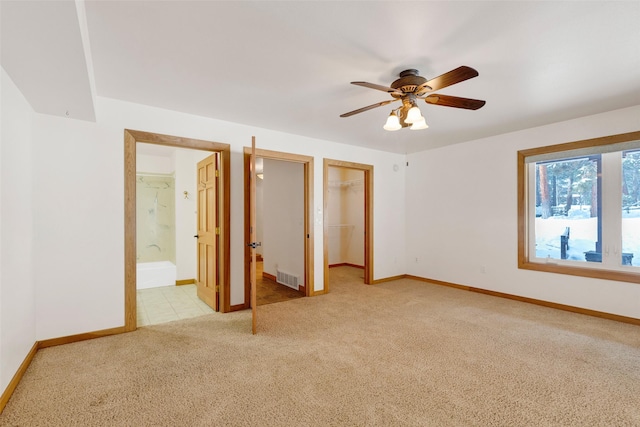 303 Wyant Ln, Hamilton, MT 59840 - unfurnished bedroom featuring light colored carpet, a walk in closet, and baseboards