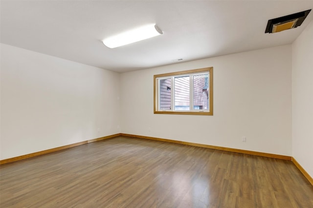 303 Wyant Ln, Hamilton, MT 59840 - spare room featuring wood finished floors and baseboards