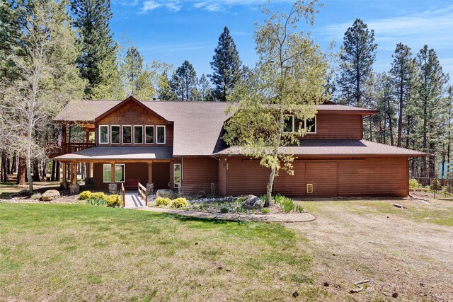 303 Wyant Ln, Hamilton, MT 59840 - view of front facade featuring a front lawn, a shingled roof, and a porch
