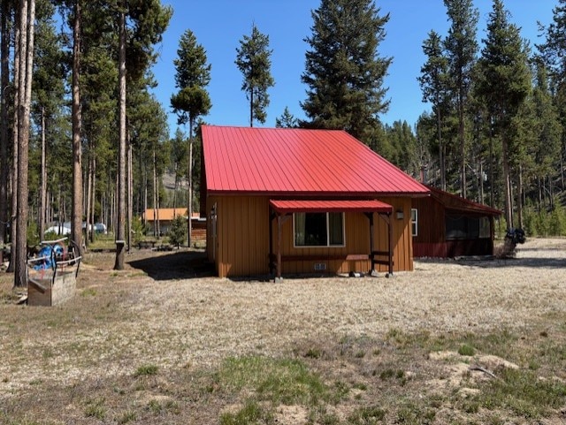 252 S P St, Sula, MT 59871 - view of outdoor structure featuring a forest view