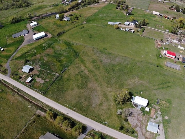 aerial view of property and surrounding area featuring rural landscape