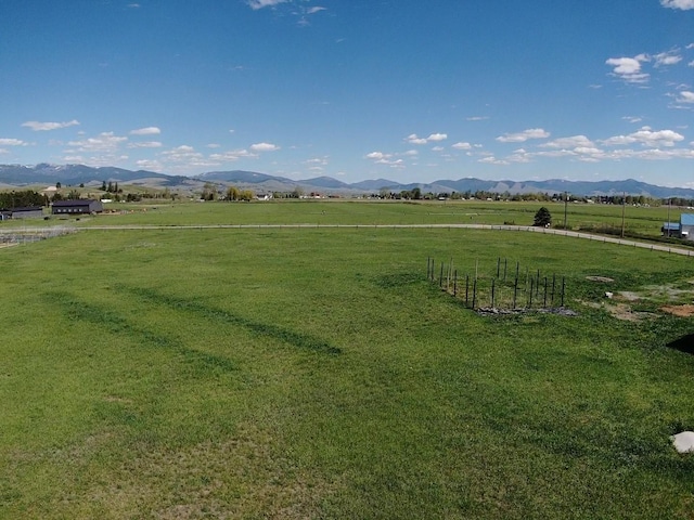 view of community featuring a mountain view and a view of rural / pastoral area