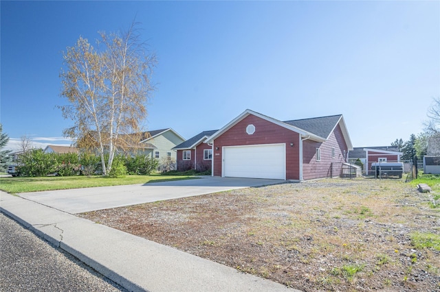 single story home featuring an attached garage and driveway