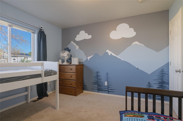 carpeted bedroom featuring baseboards