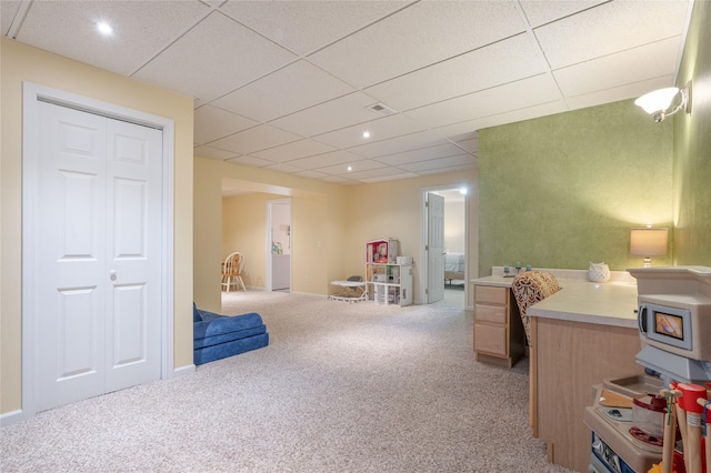 interior space featuring light carpet, a paneled ceiling, and recessed lighting