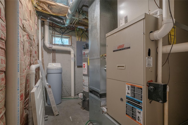 utility room with heating unit and gas water heater