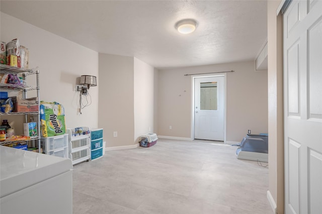 interior space featuring baseboards