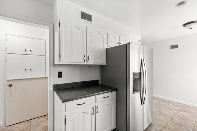3024 8th Ave S, Great Falls, MT 59405 - kitchen featuring stainless steel fridge with ice dispenser, dark countertops, baseboards, and white cabinets