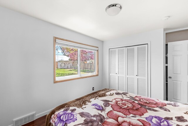 3024 8th Ave S, Great Falls, MT 59405 - bedroom with a closet, wood finished floors, and baseboards