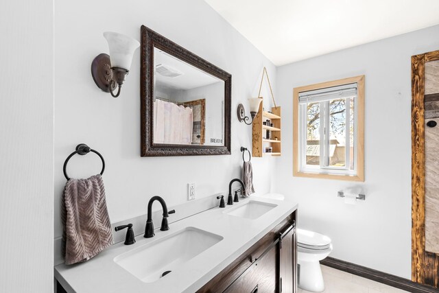 3024 8th Ave S, Great Falls, MT 59405 - full bath with toilet, double vanity, and baseboards