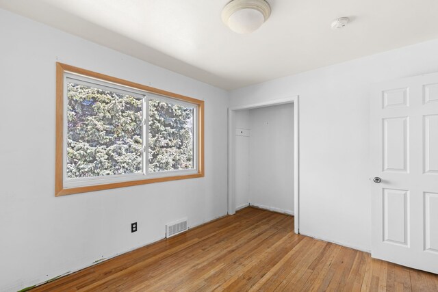3024 8th Ave S, Great Falls, MT 59405 - unfurnished bedroom featuring light wood finished floors