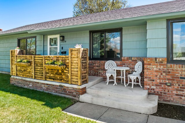 3024 8th Ave S, Great Falls, MT 59405 - rear view of house featuring a shingled roof