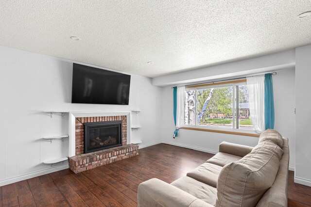 3024 8th Ave S, Great Falls, MT 59405 - living room featuring hardwood / wood-style flooring, a textured ceiling, a fireplace, and baseboards