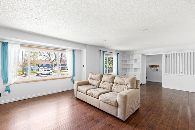 3024 8th Ave S, Great Falls, MT 59405 - living area with a textured ceiling, dark wood-style flooring, baseboards, and built in features