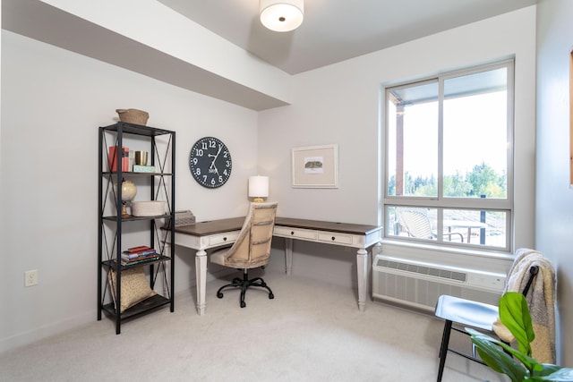 home office with light colored carpet, an AC wall unit, and baseboards