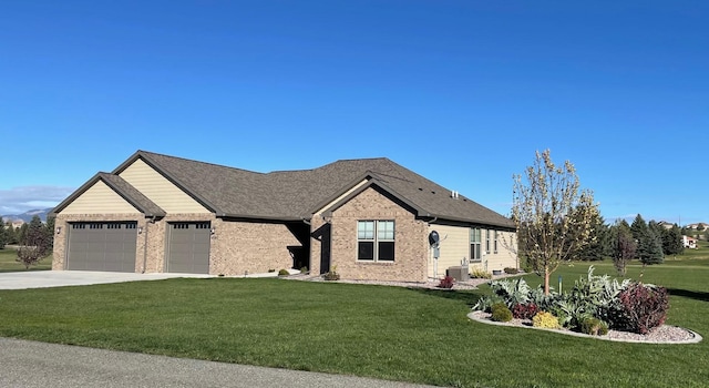 4195 Fox Hollow Dr, Helena, MT 59602 - view of front of house featuring a garage, a front yard, driveway, brick siding, and cooling unit