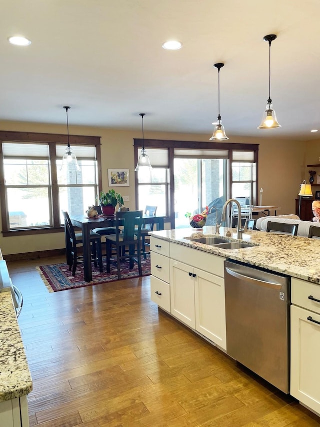 4195 Fox Hollow Dr, Helena, MT 59602 - kitchen with dishwasher, plenty of natural light, a sink, white cabinetry, and recessed lighting