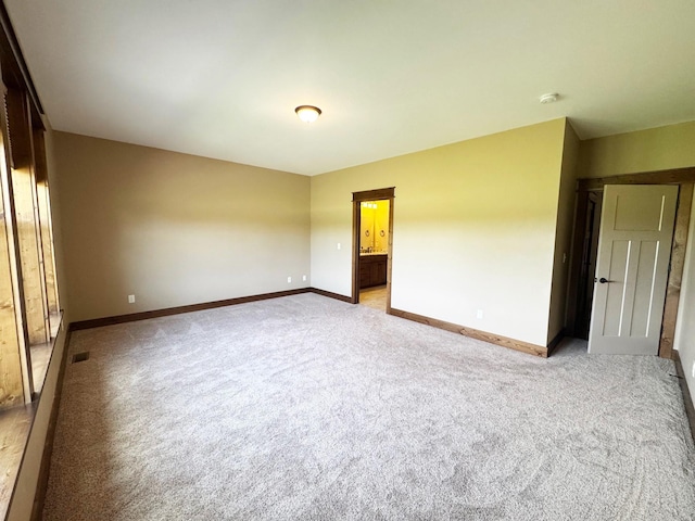4195 Fox Hollow Dr, Helena, MT 59602 - unfurnished room featuring baseboards and light carpet