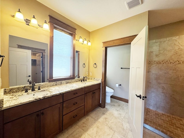 4195 Fox Hollow Dr, Helena, MT 59602 - bathroom featuring toilet, double vanity, and a walk in shower