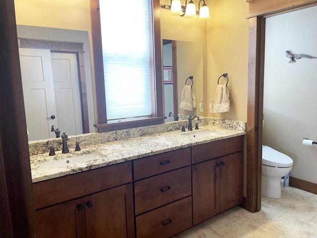 4195 Fox Hollow Dr, Helena, MT 59602 - full bathroom with toilet, double vanity, and a chandelier