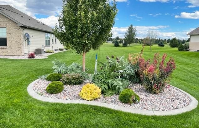 4195 Fox Hollow Dr, Helena, MT 59602 - view of grassy yard featuring central AC