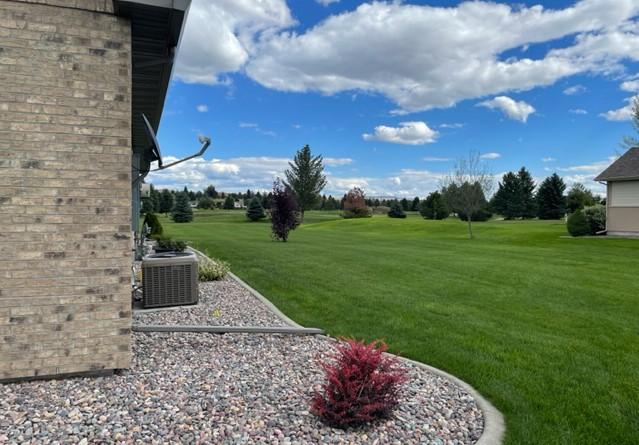 4195 Fox Hollow Dr, Helena, MT 59602 - view of green lawn with central air condition unit