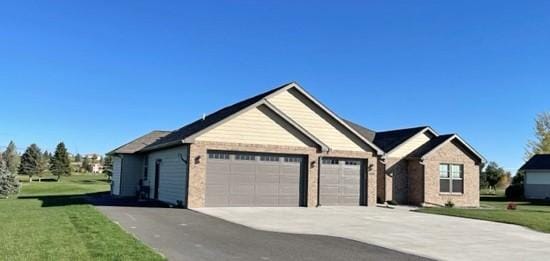 4195 Fox Hollow Dr, Helena, MT 59602 - view of front of property with a garage, driveway, and a front lawn