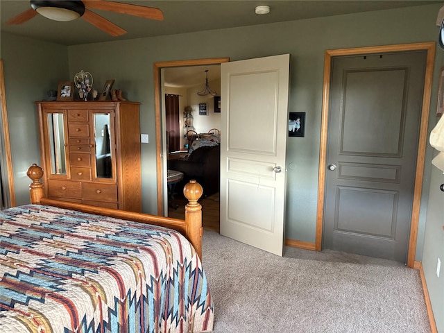 72822 Joes Ln, Arlee, MT 59821 - carpeted bedroom with baseboards and a ceiling fan