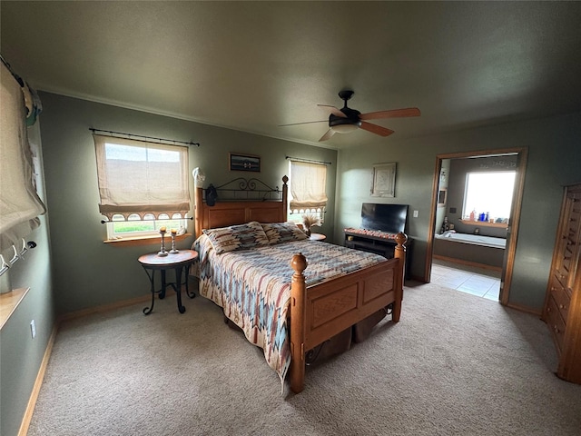 72822 Joes Ln, Arlee, MT 59821 - bedroom featuring light colored carpet, multiple windows, baseboards, and a ceiling fan