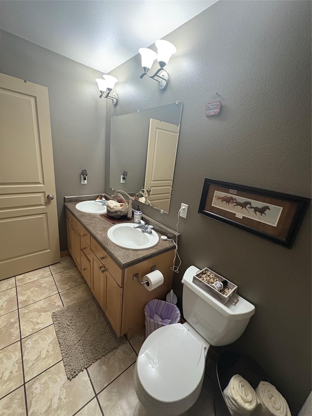 72822 Joes Ln, Arlee, MT 59821 - bathroom with tile patterned flooring, double vanity, and toilet