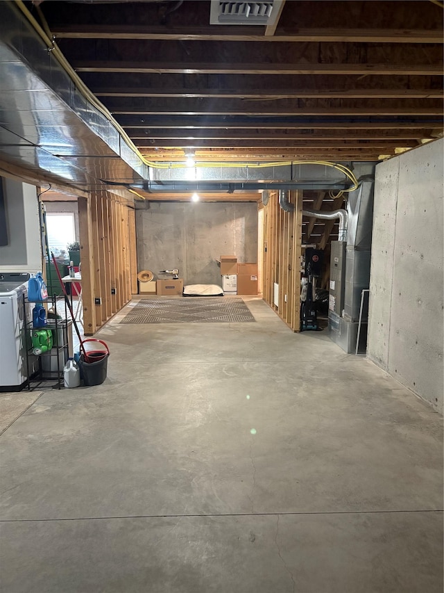 72822 Joes Ln, Arlee, MT 59821 - below grade area with washer and clothes dryer and heating unit