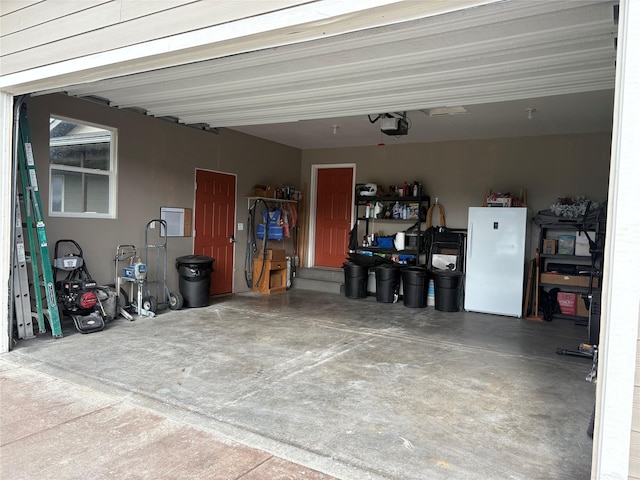 72822 Joes Ln, Arlee, MT 59821 - garage with freestanding refrigerator and a garage door opener