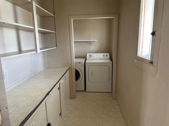 76 Missoula Ave, Butte, MT 59701 - clothes washing area featuring washer and clothes dryer, light floors, cabinet space, and baseboards