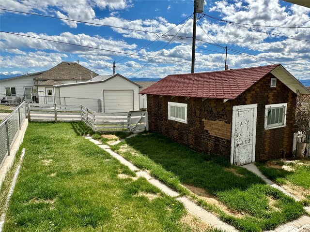 76 Missoula Ave, Butte, MT 59701 - view of yard with an outdoor structure and a garage