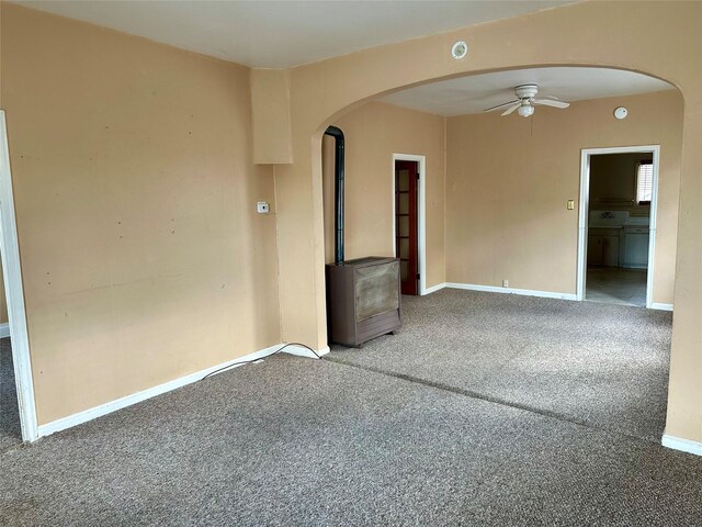 76 Missoula Ave, Butte, MT 59701 - carpeted empty room featuring arched walkways, a ceiling fan, and baseboards