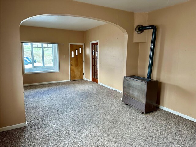 76 Missoula Ave, Butte, MT 59701 - entrance foyer with carpet, arched walkways, and baseboards