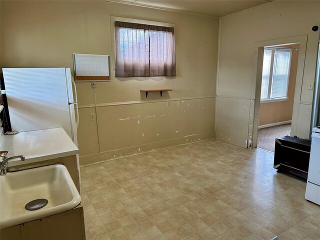 76 Missoula Ave, Butte, MT 59701 - kitchen featuring a sink, freestanding refrigerator, and baseboards