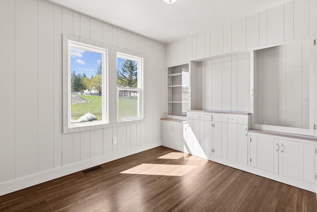 149 Vonderheide Ln, Kalispell, MT 59901 - unfurnished dining area with dark wood-type flooring and baseboards