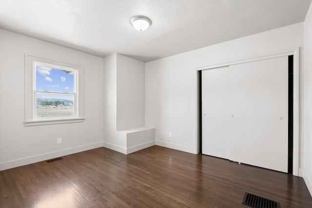 149 Vonderheide Ln, Kalispell, MT 59901 - unfurnished bedroom featuring dark wood finished floors and a closet