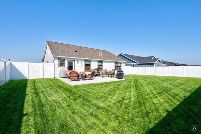 2841 Ashley Ave, East Helena, MT 59635 - back of property featuring a patio area, a shingled roof, and a gate