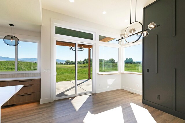 2736 Paniolo Pl, Missoula, MT 59808 - unfurnished dining area with a chandelier, baseboards, healthy amount of natural light, and recessed lighting