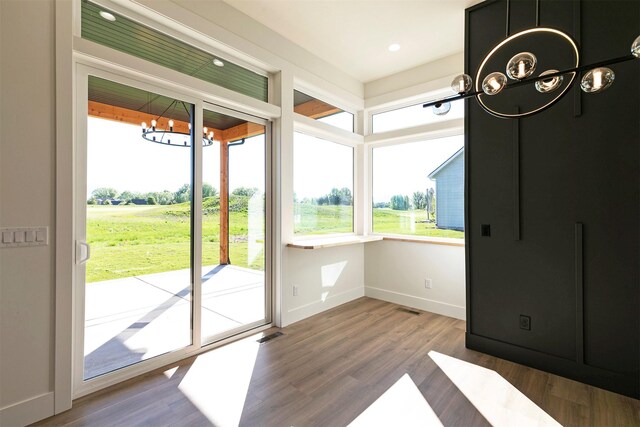 2736 Paniolo Pl, Missoula, MT 59808 - doorway to outside featuring a chandelier, baseboards, wood finished floors, and recessed lighting
