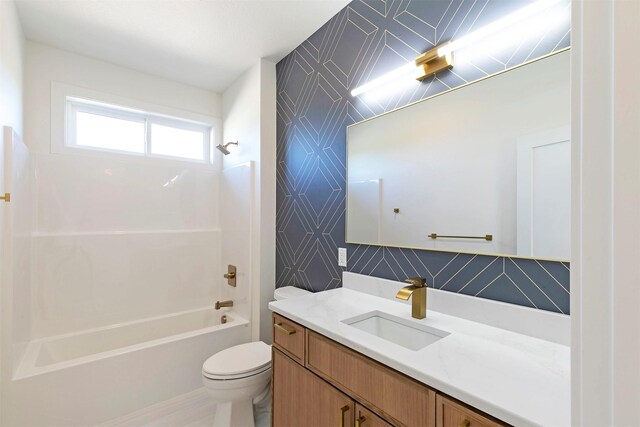 2736 Paniolo Pl, Missoula, MT 59808 - bathroom featuring wallpapered walls, shower / bath combination, toilet, and vanity