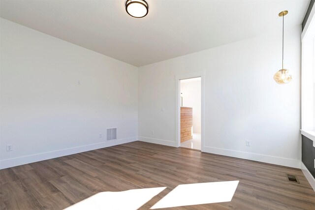 2736 Paniolo Pl, Missoula, MT 59808 - unfurnished room with baseboards and wood finished floors