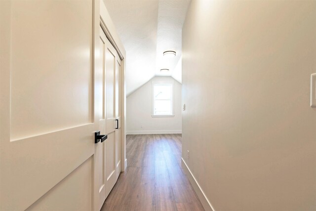 2736 Paniolo Pl, Missoula, MT 59808 - corridor with wood finished floors, baseboards, and lofted ceiling