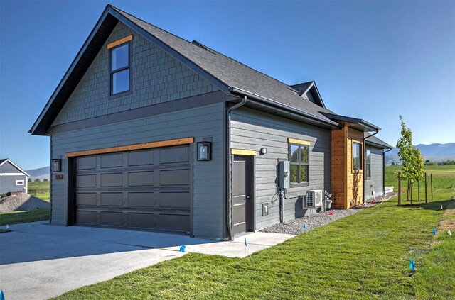 2736 Paniolo Pl, Missoula, MT 59808 - view of home's exterior with driveway, a lawn, and a mountain view
