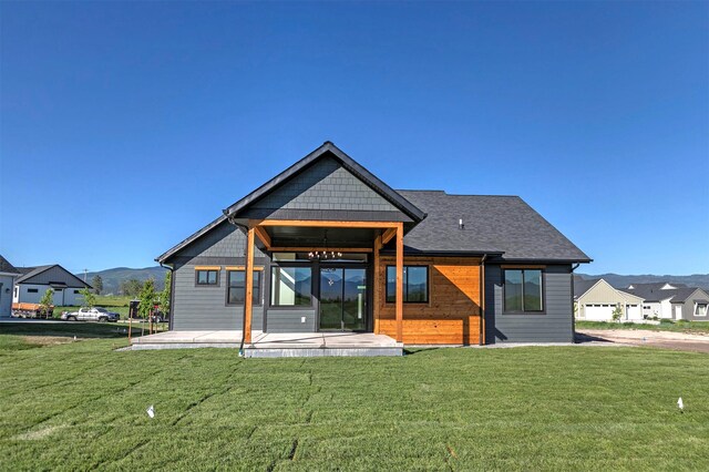 2736 Paniolo Pl, Missoula, MT 59808 - rear view of property with a patio, a yard, and a mountain view